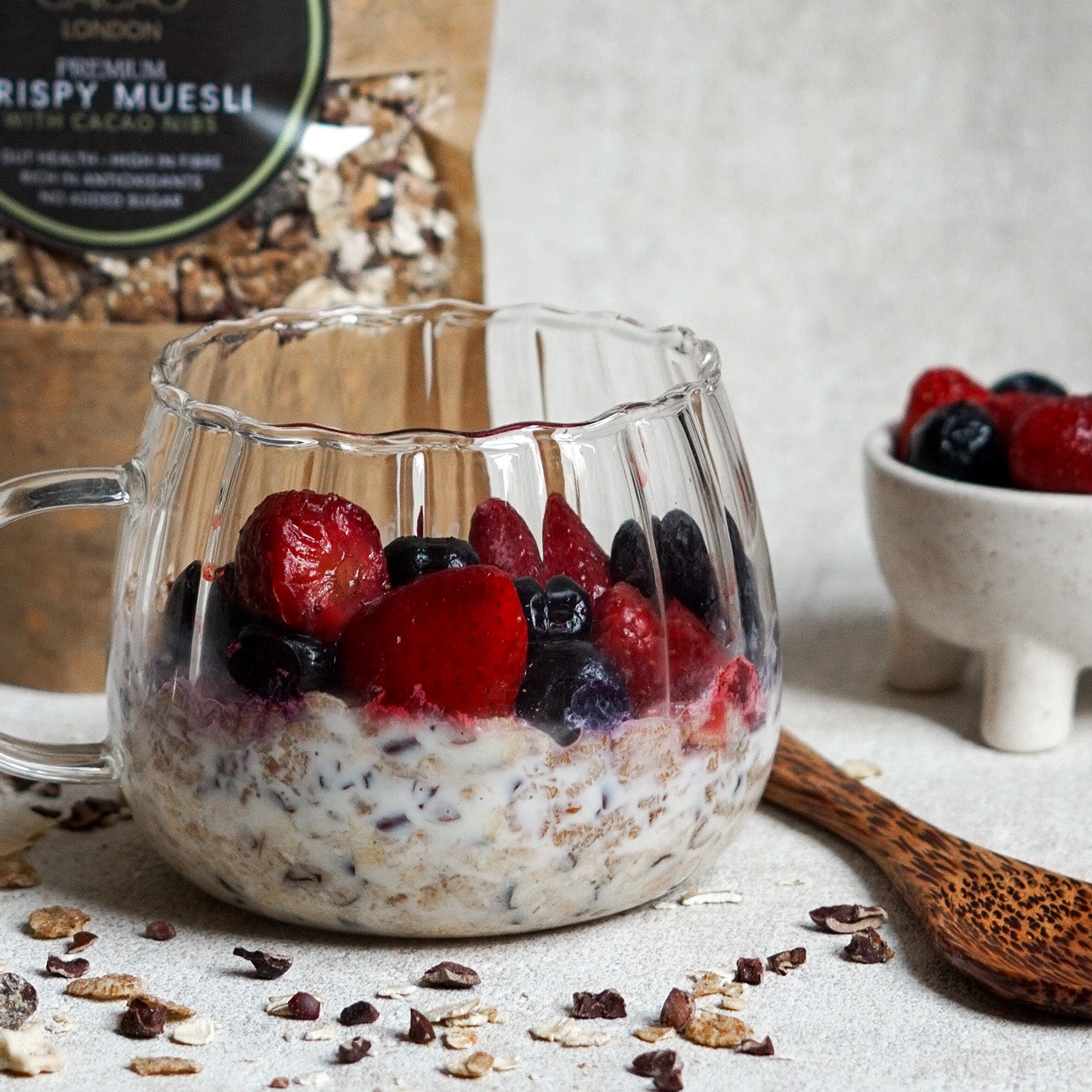 Bowl of organic cacao muesli with raw cacao nibs, oats and seeds